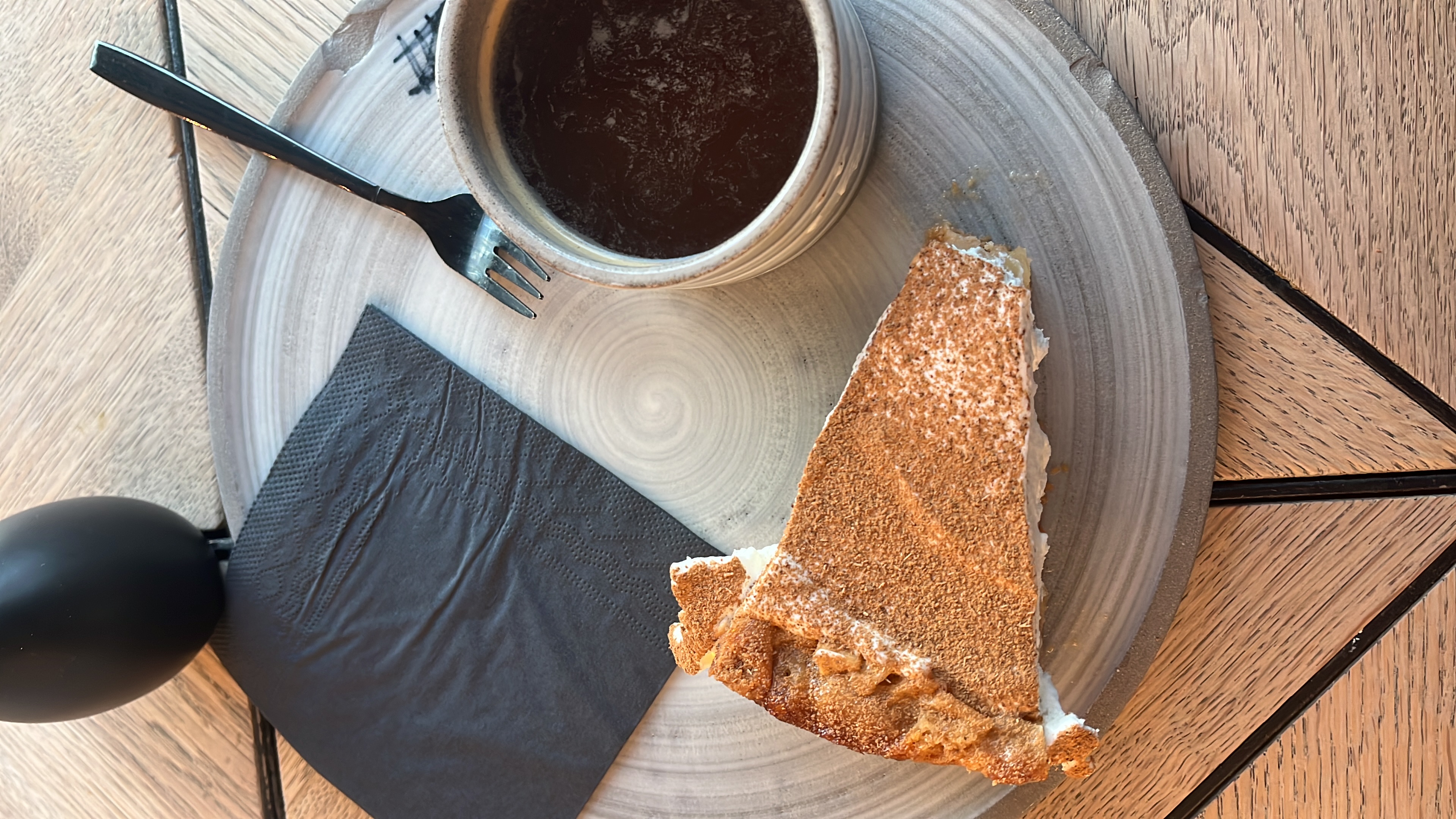 Apple cake and iced americano at a cafe